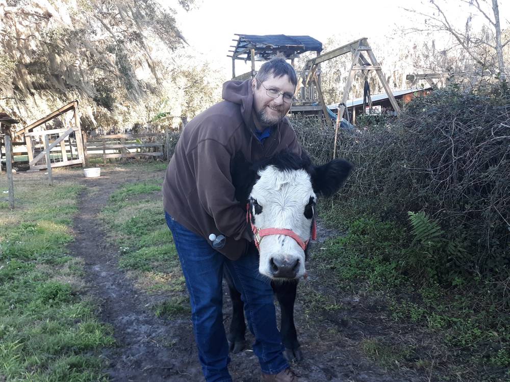 Jered with bottle calf Leita (with Josiah & Jordyn)